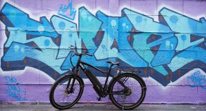 electric bike near a colorful wall 